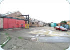 Gear shop entrance on the left with the oil store on the right